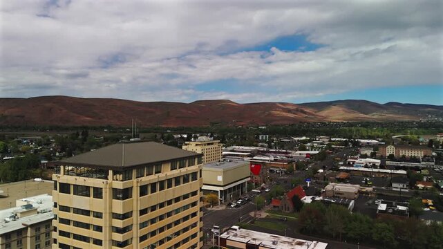 Aerial view of downtown Yakima office building and hills