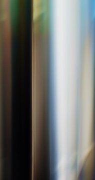 Colorful light refraction of smooth reflective glass prism with lens chromatic aberration and optical distortion effects in a rainbow of colors. Shining lights reflect highlights on angled glass Loop