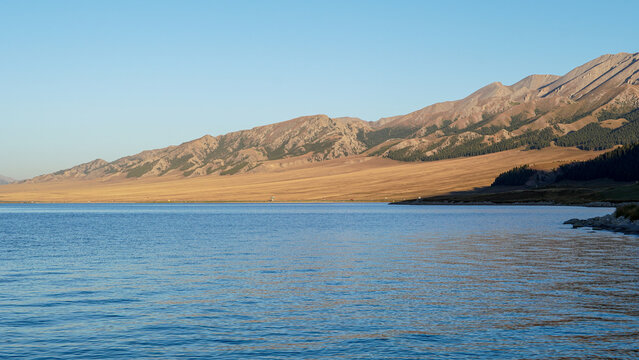 Alpine Lake And Wilderness Under Morning Light At Sayram Lake