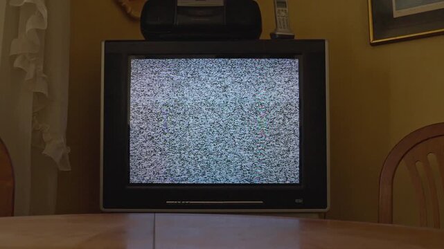 Vintage cathode ray tube televisions displaying analog static noise