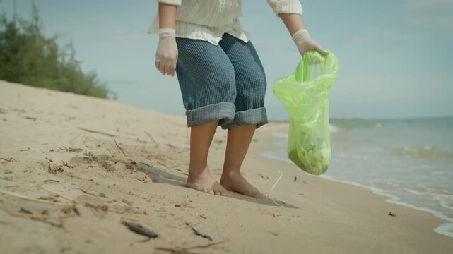 Save water. Volunteer pick up trash garbage at the beach and plastic bottles are difficult decompose prevent harm aquatic life. Earth, Environment, Greening planet, reduce global warming, Save world