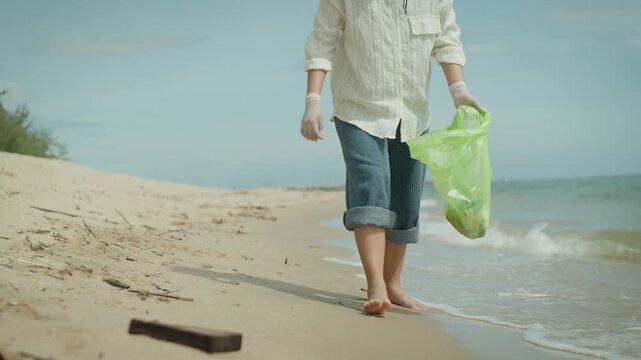 Save water. Volunteer pick up trash garbage at the beach and plastic bottles are difficult decompose prevent harm aquatic life. Earth, Environment, Greening planet, reduce global warming, Save world