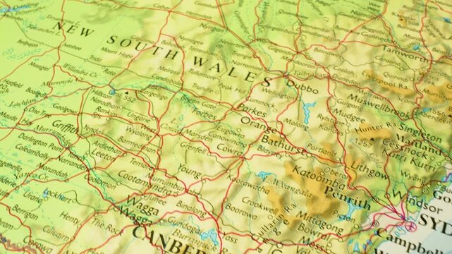 Australia, New South Wales &ndash; sliding camera view across a printed physical map toward Sydney and Canberra