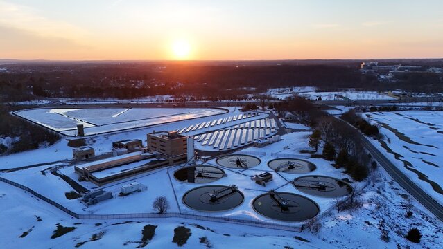 Aerial view of a Wilmington wastewater treatment plant after snow in winter