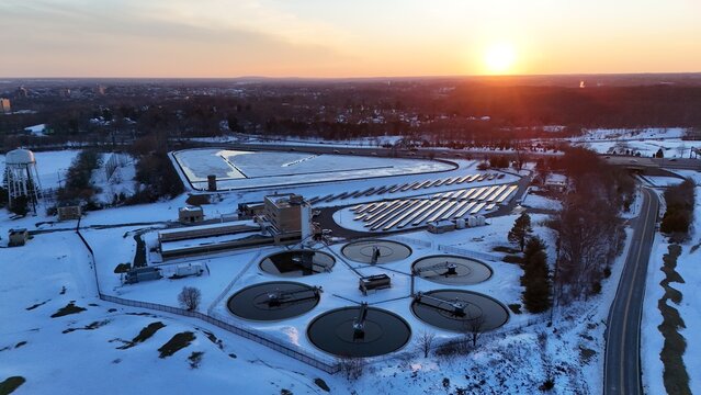 Aerial view of a Wilmington wastewater treatment plant after snow in winter