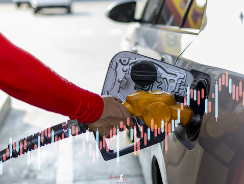 Fuel gasoline hand pump car refueling vehicle petrol station energy transportation economy price market finance chart investment business automotive technology urban travel liquid power industry