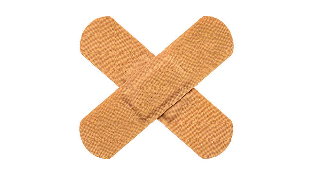 Two adhesive medical bandages crossed neatly into an X shape on transparent background