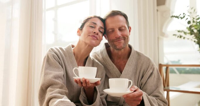 Couple, mature and peace with tea at spa, trust or commitment with stress relief on anniversary trip. Calm, relax and embrace with herbal drink, people and together on relationship milestone holiday