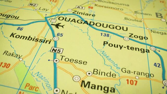 Flyover to Ouagadougou, Burkina Faso &ndash; smooth camera movement over a physical atlas map