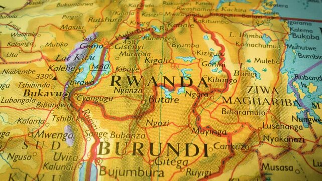 Gliding view to Rwanda, Africa &ndash; sliding camera movement over a printed map