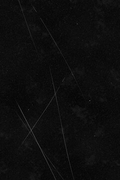Black grunge film scratches overlay texture, hero scratches style on black background