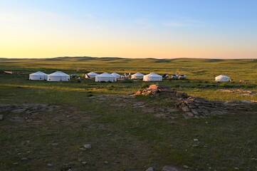Scenic view of yurt camp in Mongolian steppe during sunrise © Vedrana