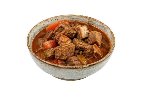 Hearty beef stew with tender meat chunks and vibrant carrots in a rich, savory sauce, served in a rustic bowl on a white background