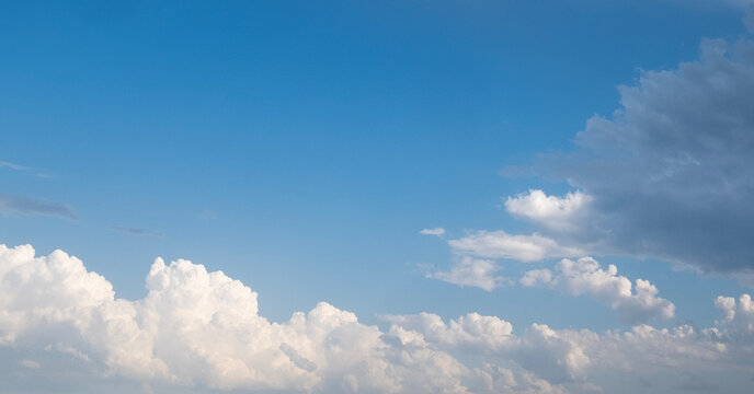 White puffy clouds against blue sky
