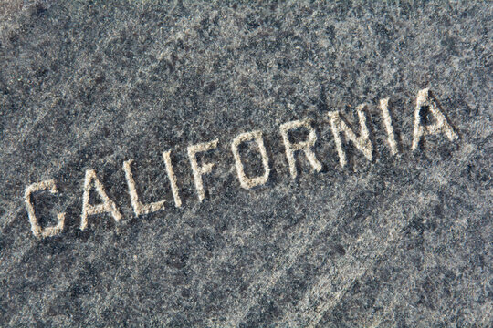 California carved in gray stone