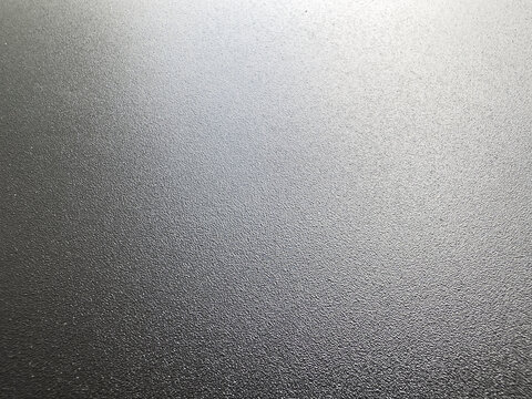 Textured black metal surface
