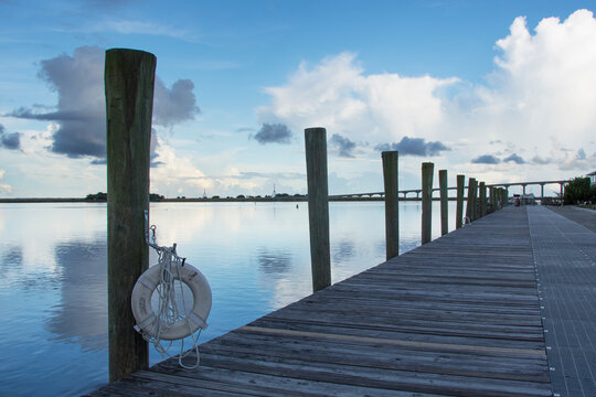 Empty pier on calm Apalachicola River at evening