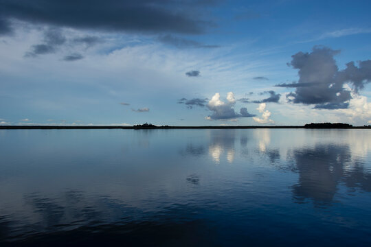 Calm surface of Apalachicola River reflecting evening sky