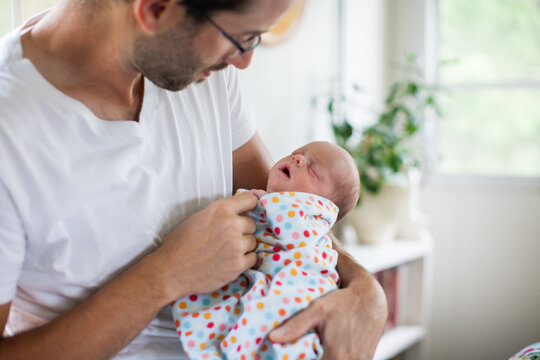 A father holds his baby