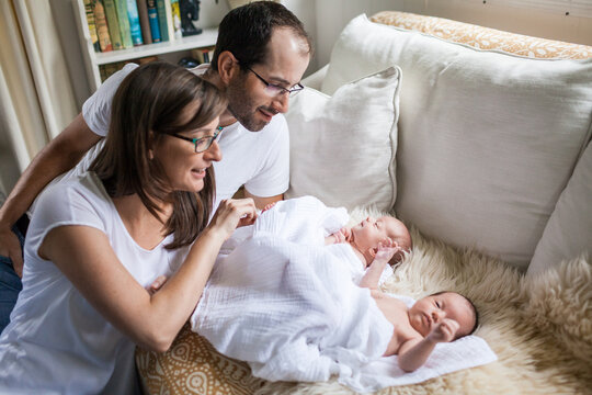 Mother and father adore their newborn twin babies
