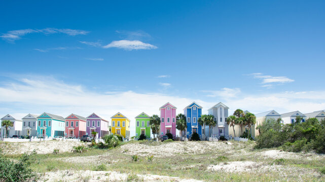 Row of colorful beach houses on sunny day