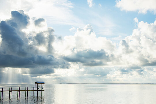 White puffy clouds over calm St. George Sound