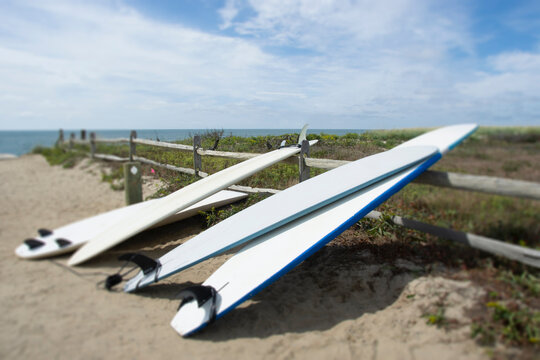 Surfboards leaning on fence at Cisco Beach