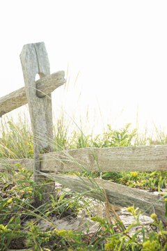 Close-up of old wood fence post in field