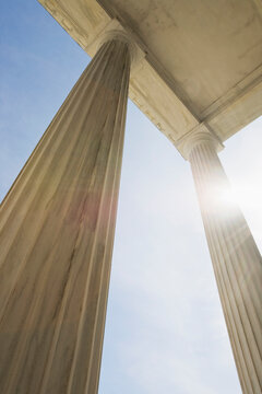 Low angle view of marble columns against sky