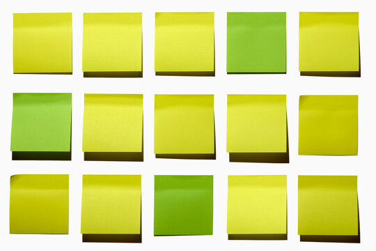 Multiple blank post it notes on white background