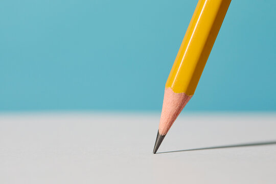 Close-up of pencil on white paper