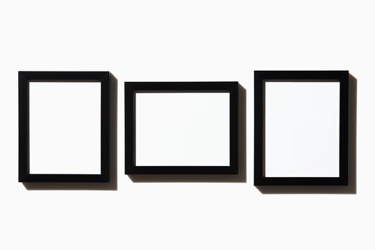 Three black picture frames on white background