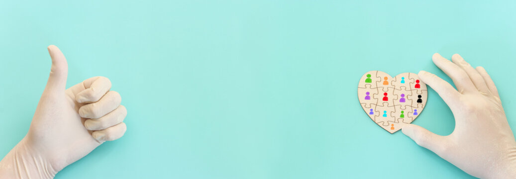 Top view image of doctor or nurse with gloves and puzzle pieces over blue background