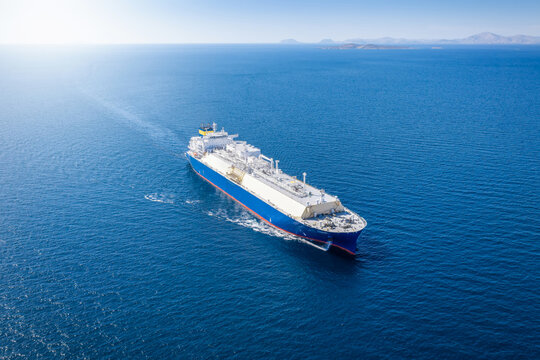 High Aerial top view of a big LNG or fossil fuel tanker in motion as a concept for transport and energy