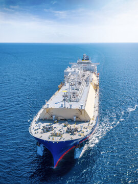 Aerial front view of a LNG or fossil fuel tanker ship traveling over the ocean as a concept for transport and energy