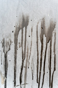 Abstract stains dripping on gray textured surface