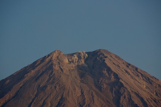 Semeru Volcano Releasing a Small Ash Plume from Its Summit in East Java, Indonesia