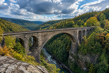 Fototapeta premium Old stone railroad bridge spanning a deep gorge in the Allegheny valley.