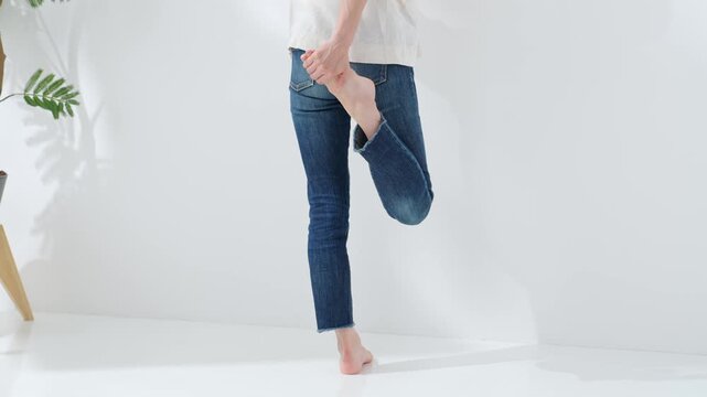 A middle-aged woman stretching. Health, healthcare, healthy, body care, casual, lifestyle, smile
