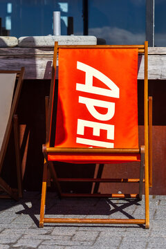 A vibrant orange deck chair with an apres ski design positioned outside a mountain lodge at Whakapapa Ski Field, New Zealand