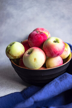 Ceramic bowl filled with fresh apples
