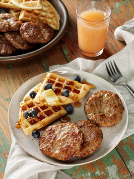 Beef breakfast sausage patties with waffles, blueberries, butter