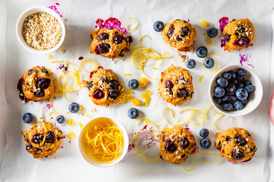 Oatmeal blueberry biscuits with lemon zest on parchment paper