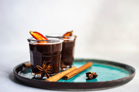 Hot chocolate dessert with spices on blue plate