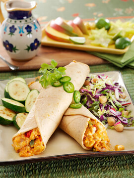 Chicken and cheese enchiladas with sauteed zucchini and cabbage slaw