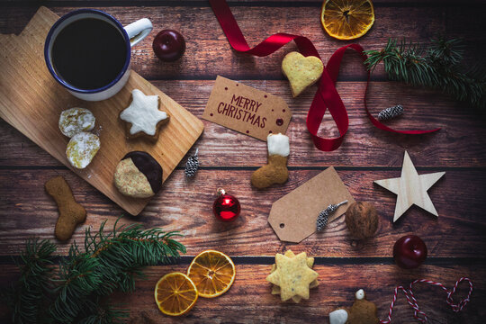 Christmas arrangement of biscuits, coffee, and festive decorations