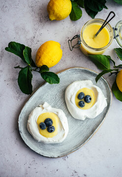 Meringue nests with lemon Curd and blueberries dessert
