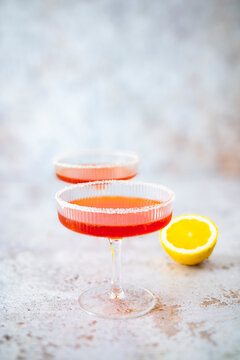 Greek Sidecar cocktail with brandy and pomegranate liqueur in glasses