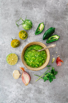 Salsa verde sauce with fresh ingredients in a bowl