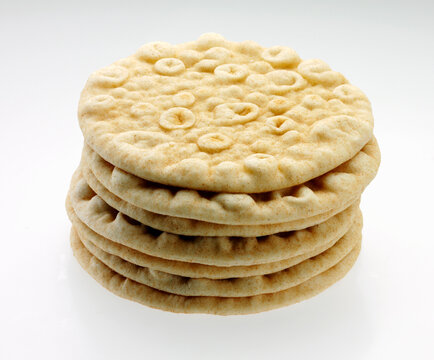 Stack of Pita bread rounds on white background
